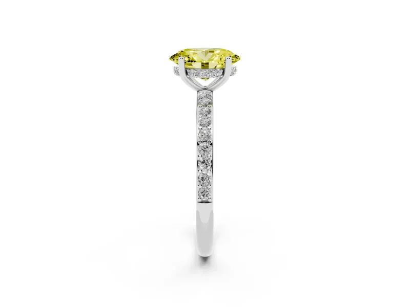 Fancy Yellow Oval Cut Diamond Pavé Band Ring Set in White gold with Prong-Set Center Stone