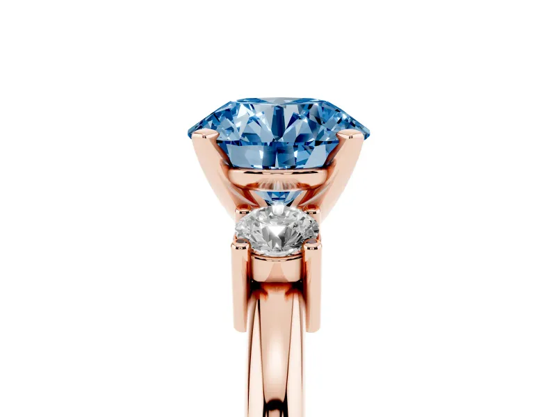 Fancy Blue Three-Stone Round Cut Diamond Ring Set in Rose gold with Prong Setting and Plain Band