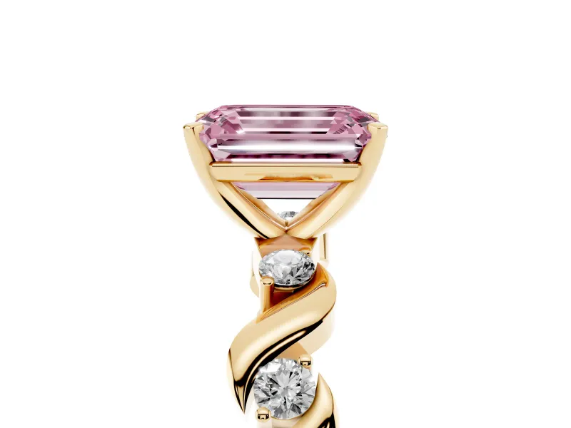 Fancy Pink Emerald Cut Diamond Solitaire Ring Set in Yellow gold with Ribbon Twist Band, Round Accents and Prong Setting