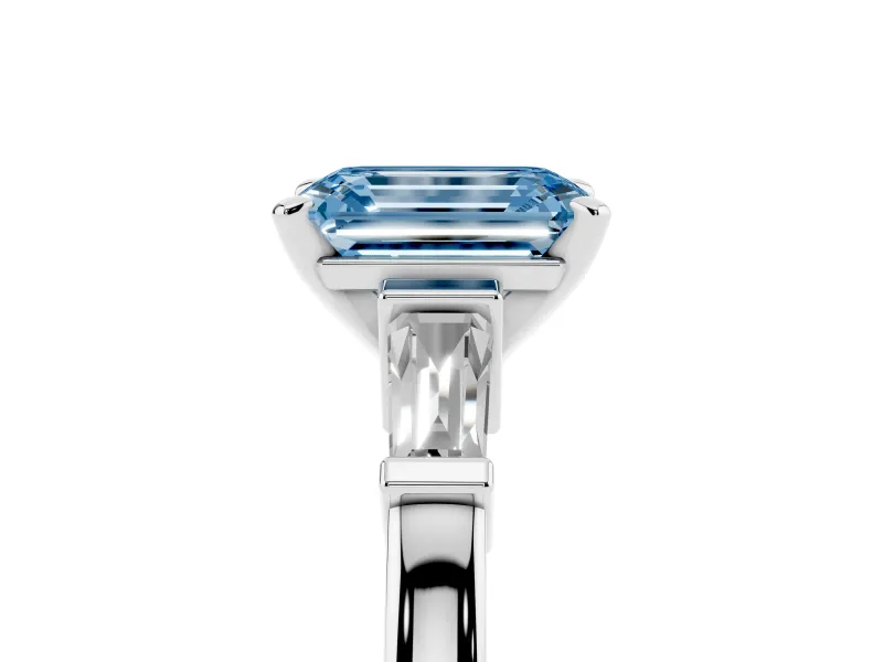 Fancy Blue Emerald Cut Diamond Solitaire Ring Set in Silver with Tapered Baguette Accents and Prong Setting