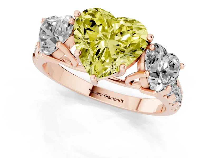 Fancy Yellow Heart Cut Diamond Three-Stone Ring Set in Rose gold with Pavé Band