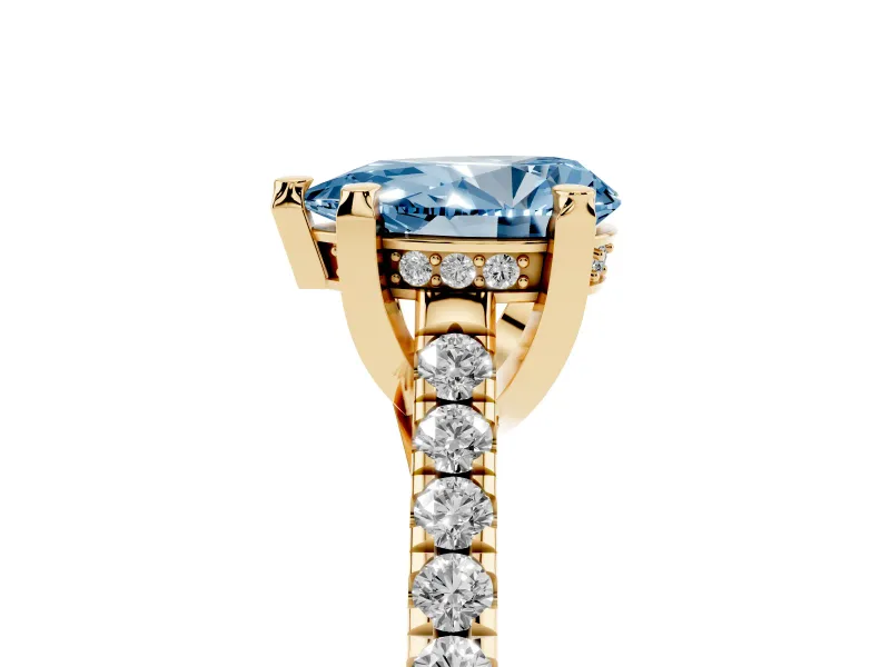 Fancy Blue Pear Cut Diamond Solitaire Ring Set in Yellow gold with Brilliant Pavé Band and Prong Setting