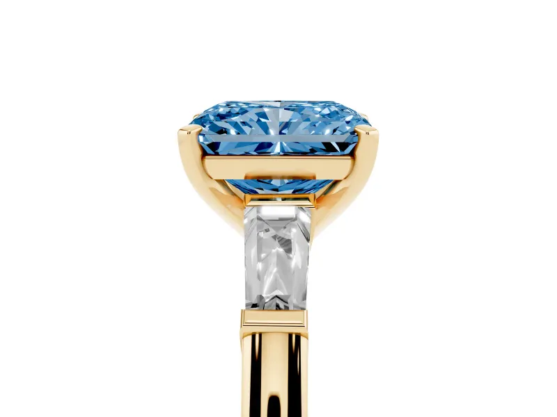 Radiant Cut Three Stone Engagement Ring Setting for a Fancy Blue Lab-Grown Diamond | Tapered Baguettes | Yellow Gold