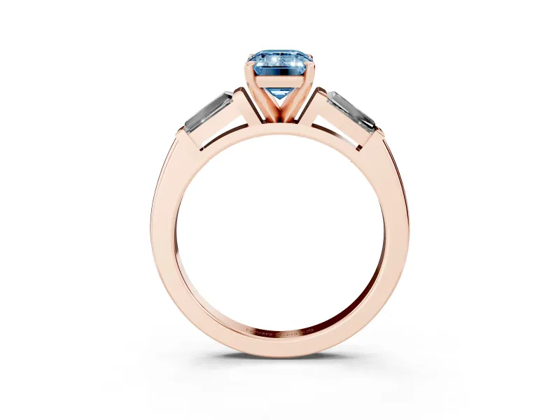 Fancy Blue Emerald Cut Diamond Solitaire Ring Set in Rose gold with Tapered Baguette Side Stones and Prong Setting