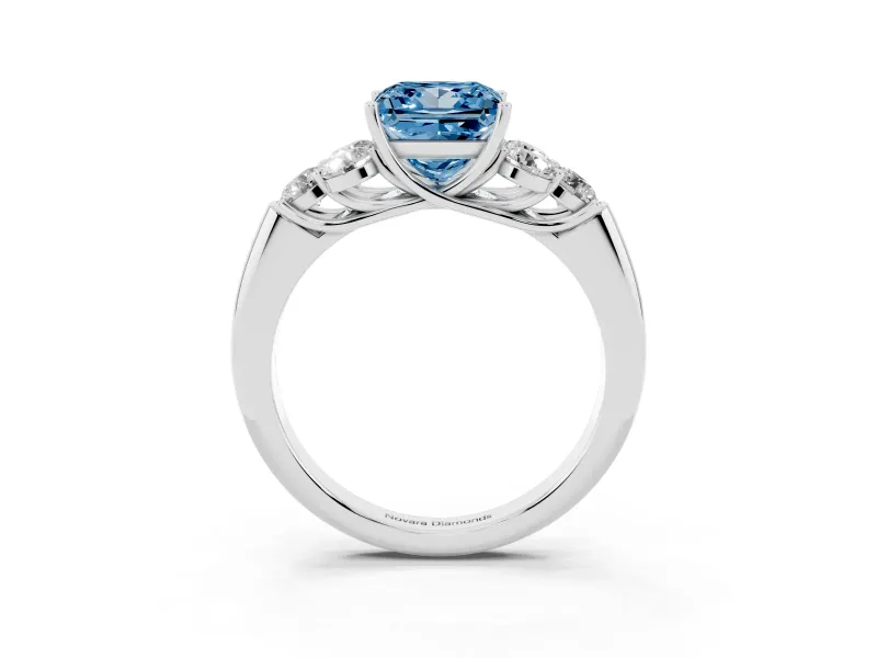 Fancy Blue Princess Cut Diamond Cluster Ring Set in Platinum with Round Accent Stones and Prong Setting on a Plain Band