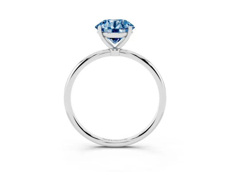 Fancy Blue Round Cut Diamond Solitaire Engagement Ring Set in Silver with Thin Band and Prong Setting