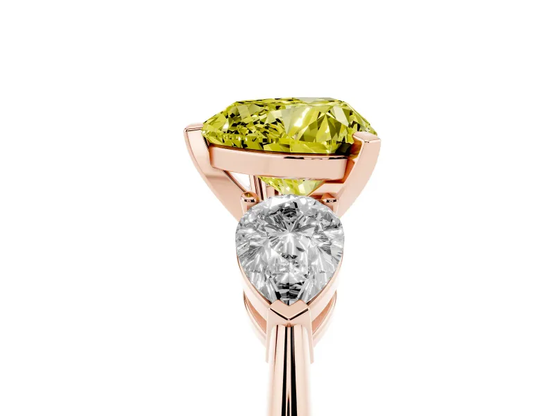 Fancy Yellow Three-Stone Heart Cut Diamond Ring Set in Rose gold with Pear Side Stones and Prong Setting