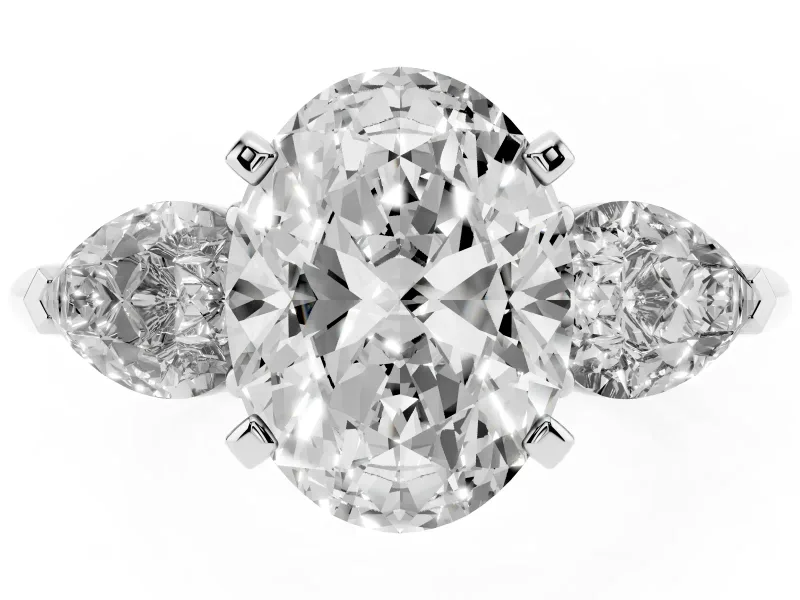 Three-Stone Oval Cut Diamond Ring Set in White gold with Pear Side Stones and Prong Setting