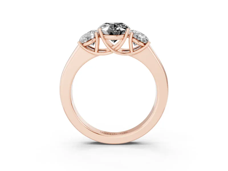 Fancy Black Three-Stone Oval Cut Diamond Ring Set in Rose gold with Matching Prong Settings and Plain Band