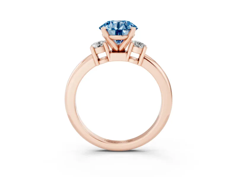 Fancy Blue Three-Stone Round Cut Diamond Ring Set in Rose gold with Prong Setting and Plain Band