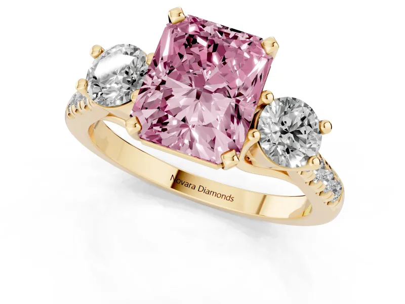 Fancy Pink Three-Stone Radiant Cut Diamond Pavé Band Ring Set in Yellow gold with Prong-Set Trio