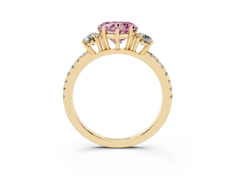 Fancy Pink Heart Cut Diamond Three-Stone Ring Set in Yellow gold with Pavé Band and Graduated Sides