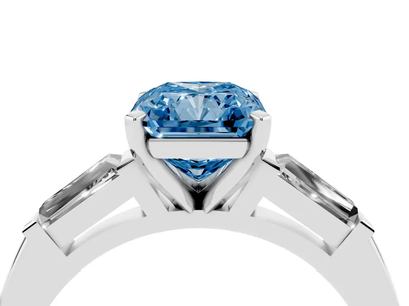 Fancy Blue Radiant Cut Diamond Solitaire Ring Set in Silver with Tapered Baguette Side Stones and Prong Setting