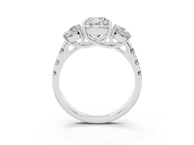 Cushion Cut Diamond Three-Stone Ring Set in Platinum with Pavé Band