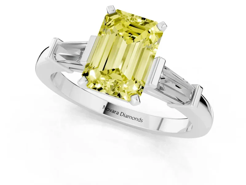 Fancy Yellow Emerald Cut Diamond Solitaire Ring Set in Platinum with Tapered Baguette Accents and Prong Setting