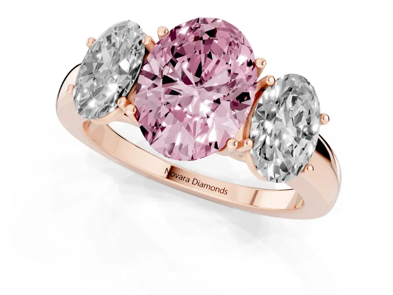 Fancy Pink Oval Cut Diamond Three-Stone Ring Set in Rose gold with Bold Center and Classic Band