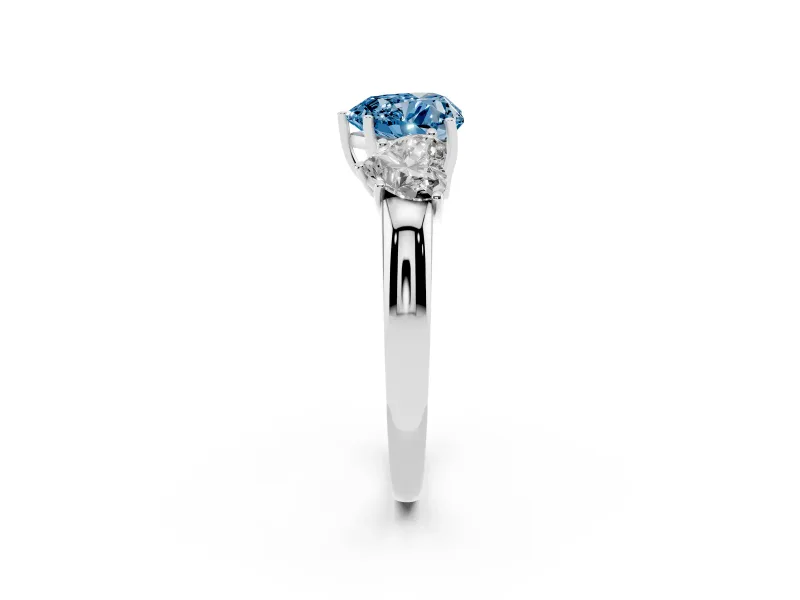 Fancy Blue Heart Cut Diamond Three-Stone Ring Set in Platinum with Bold Center and Classic Band