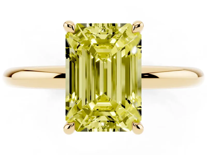 Fancy Yellow Emerald Cut Diamond Solitaire Ring Set in Yellow gold with Thin Band and Prong Setting