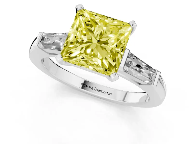 Fancy Yellow Princess Cut Diamond Solitaire Ring Set in White gold with Tapered Baguette Side Stones and Prong Setting