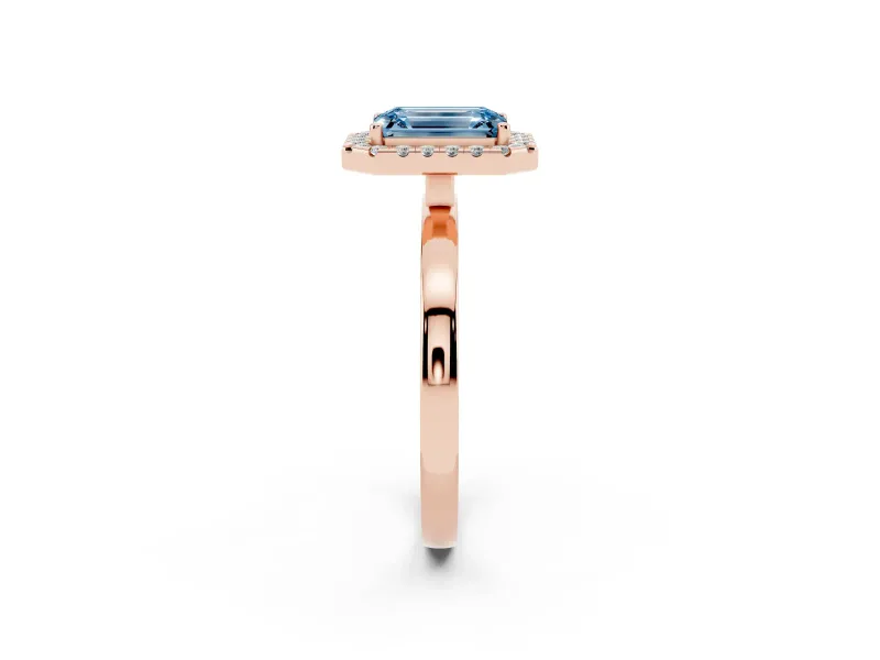 Fancy Blue Emerald Cut Diamond Halo Solitaire Ring Set in Rose gold with Pavé Band and Prong Setting