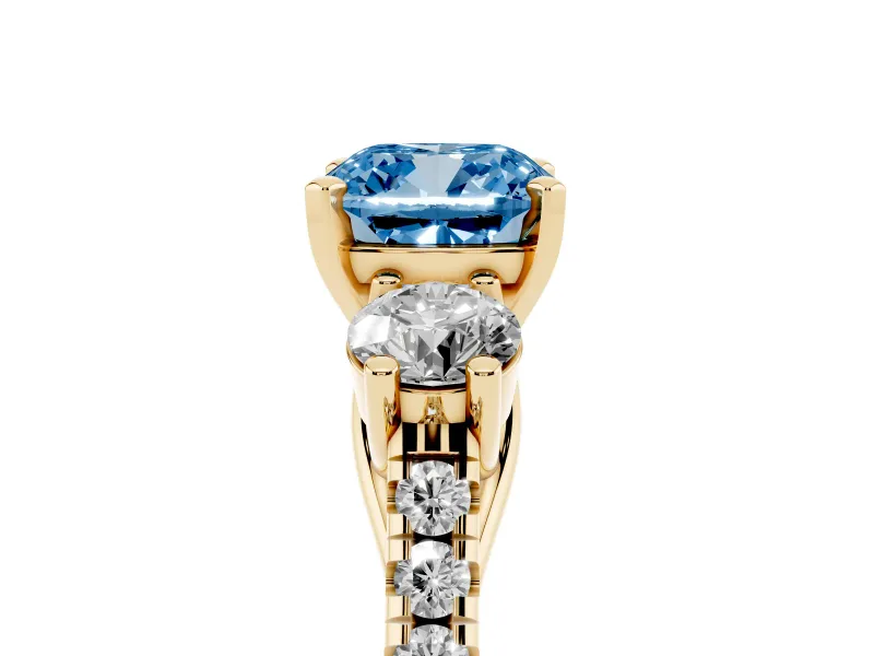 Fancy Blue Three-Stone Cushion Cut Diamond Pavé Band Ring Set in Yellow gold with Prong-Set Trio