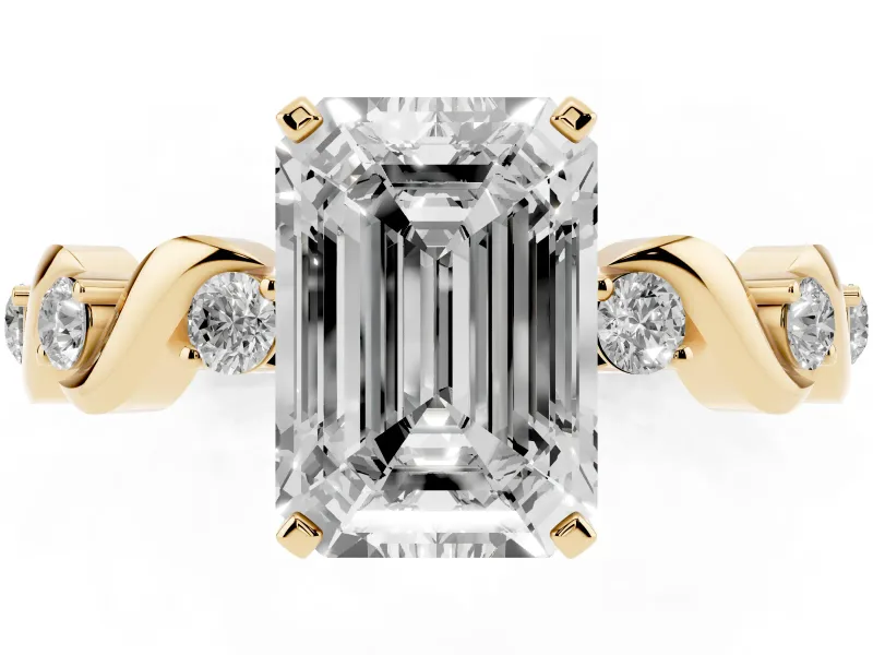 Emerald Cut Diamond Solitaire Ring Set in Yellow gold with Ribbon Twist Band, Round Accents and Prong Setting