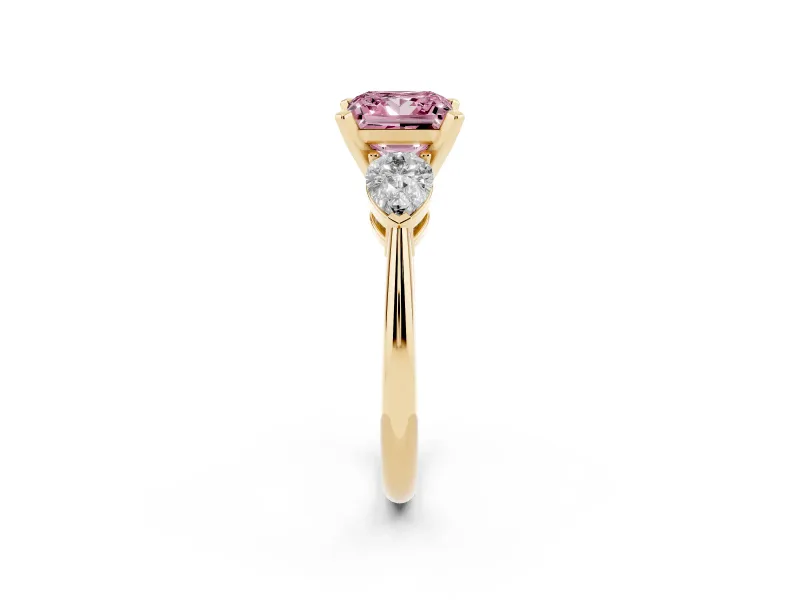 Fancy Pink Three-Stone Princess Cut Diamond Ring Set in Yellow gold with Pear Side Stones and Prong Setting