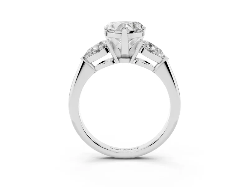 Three-Stone Heart Cut Diamond Ring Set in Platinum with Pear Side Stones and Prong Setting