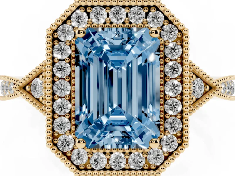 Fancy Blue Emerald Cut Diamond Halo Engagement Ring Set in Yellow gold with Milgrain Pavé Band