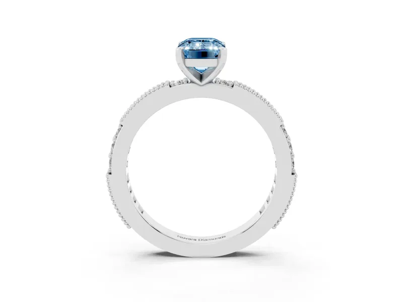 Fancy Blue Emerald Cut Diamond Solitaire Ring Set in Platinum with Slim Pavé Band and Prong Setting