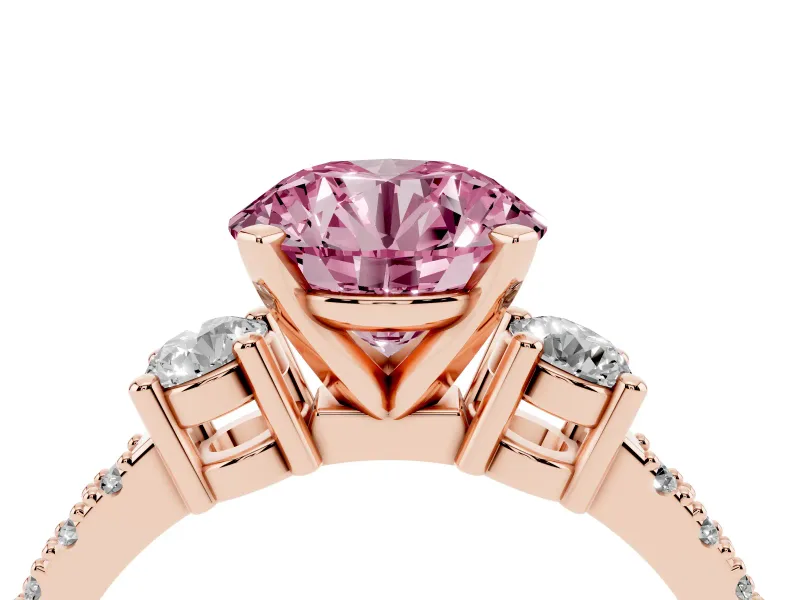 Fancy Pink Three-Stone Round Cut Diamond Pavé Band Ring Set in Rose gold with Prong Setting