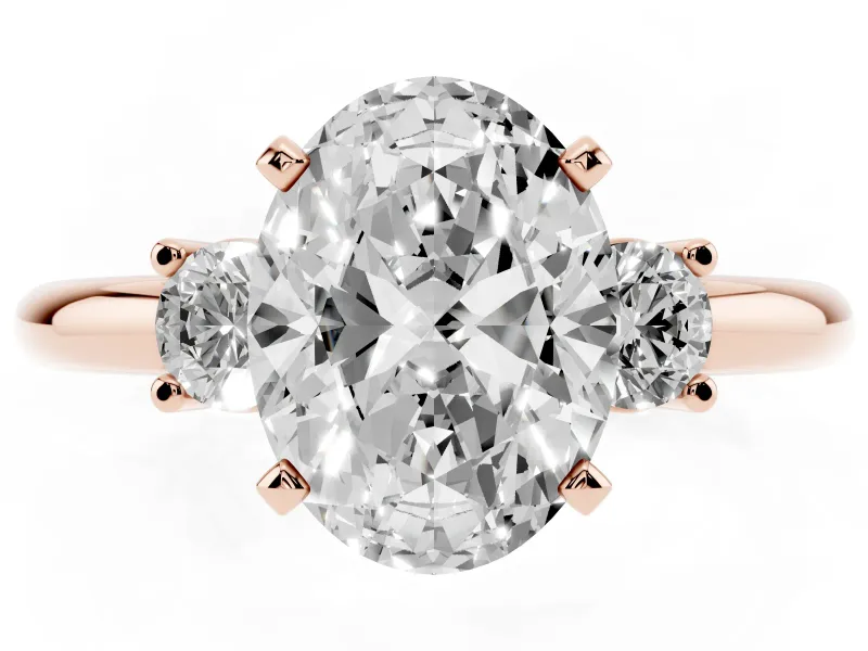 Three-Stone Oval Cut Diamond Ring Set in Rose gold with Prong Setting and Plain Band