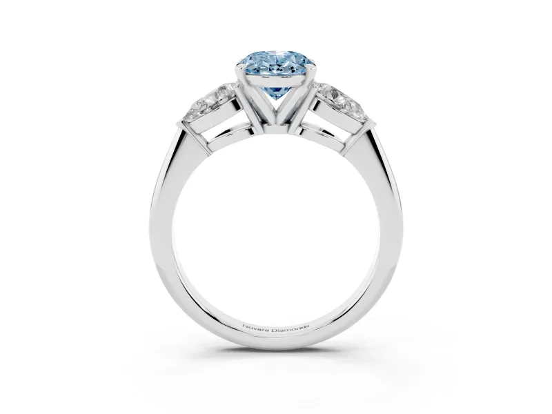 Fancy Blue Three-Stone Oval Cut Diamond Ring Set in White gold with Pear Side Stones and Prong Setting