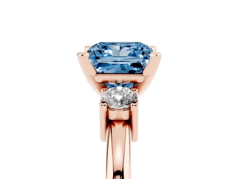 Fancy Blue Three-Stone Princess Cut Diamond Ring Set in Rose gold with Prong Setting and Plain Band