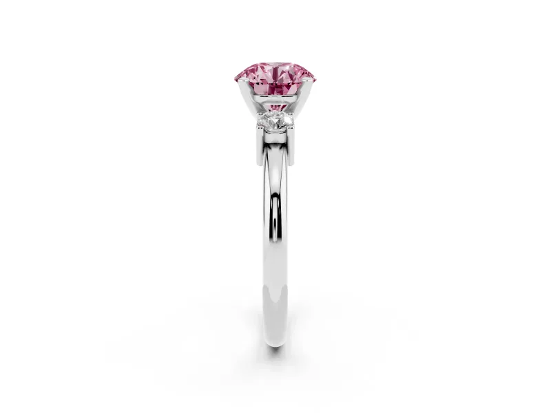 Fancy Pink Three-Stone Round Cut Diamond Ring Set in White gold with Prong Setting and Plain Band