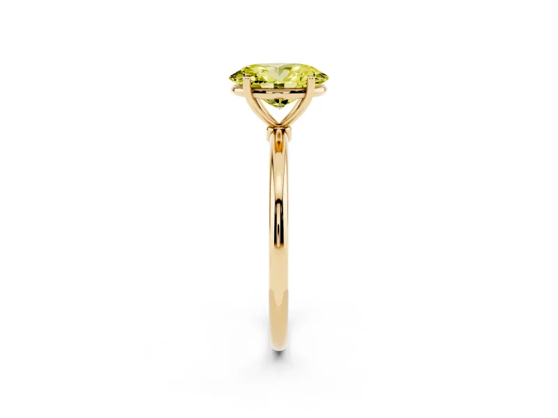 Fancy Yellow Oval Cut Diamond Solitaire Engagement Ring Set in Yellow gold with Thin Band and Prong Setting