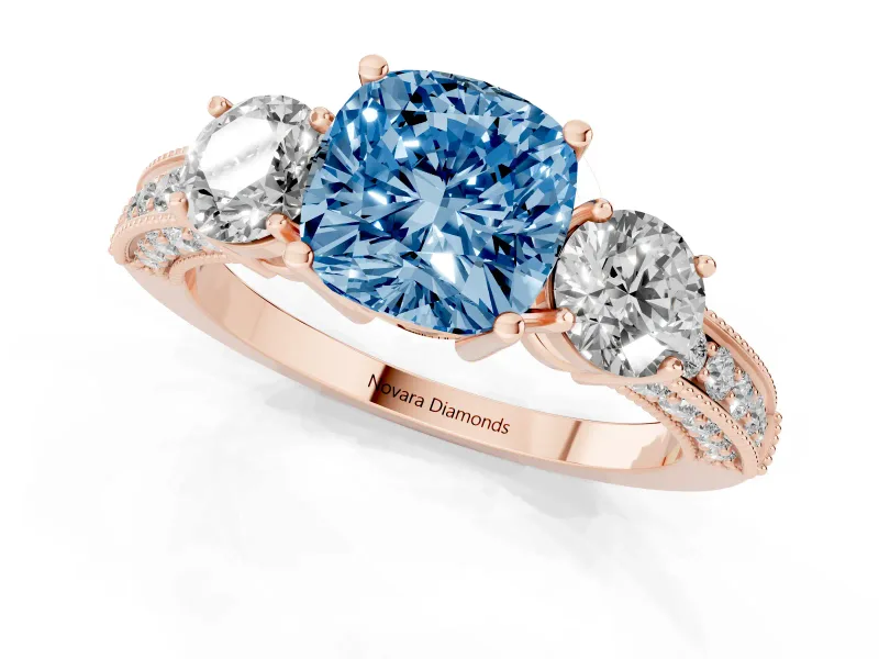 Fancy Blue Cushion Cut Diamond Three-Stone Ring Set in Rose gold with Round Side Stones and Pavé Band