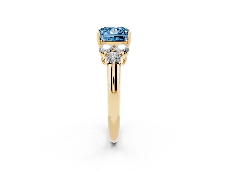 Fancy Blue Princess Cut Diamond Cluster Ring Set in Yellow gold with Round Accent Stones and Prong Setting on a Plain Band