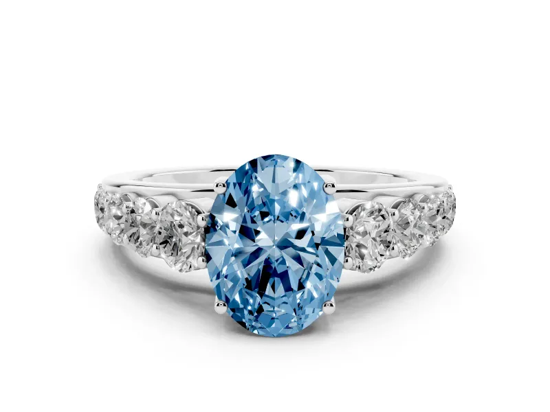 Fancy Blue Oval Cut Diamond Solitaire Ring Set in White gold with Pavé-Set Band and Prong Setting