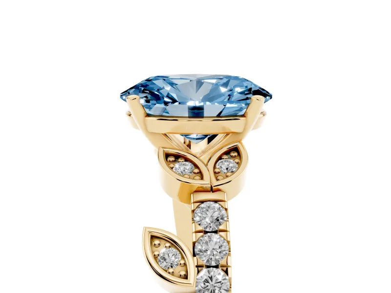 Fancy Blue Oval Cut Diamond Solitaire Leaf-Inspired Ring Set in Yellow gold with Pavé Band and Prong Setting