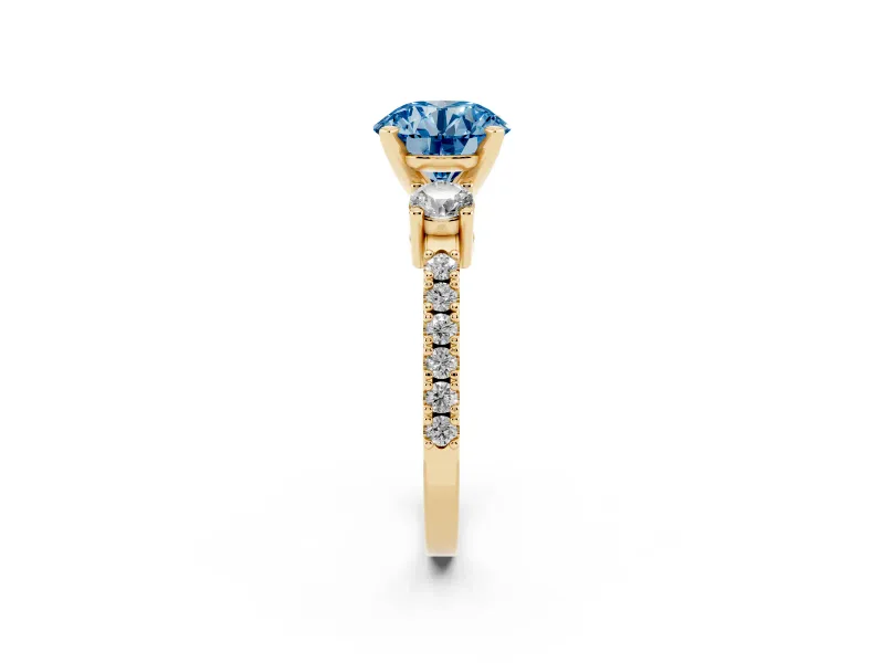 Fancy Blue Three-Stone Round Cut Diamond Pavé Band Ring Set in Yellow gold with Prong Setting