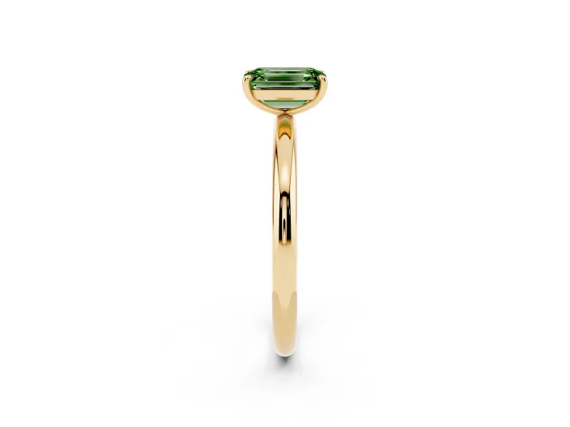 Fancy Green Emerald Cut Diamond Solitaire Ring Set in Yellow gold with Prong Setting on a Polished Plain Band