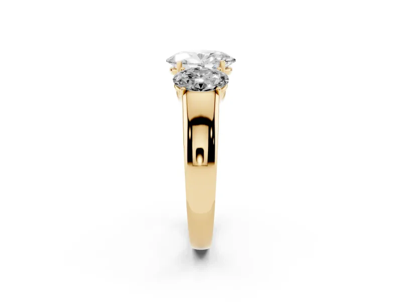 Three-Stone Oval Cut Diamond Ring Set in Yellow gold with Matching Prong Settings and Plain Band