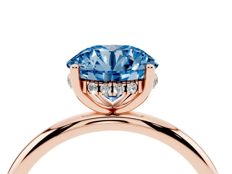 Fancy Blue Round Cut Diamond Solitaire Engagement Ring Set in Rose gold with Prong Setting and Polished Band