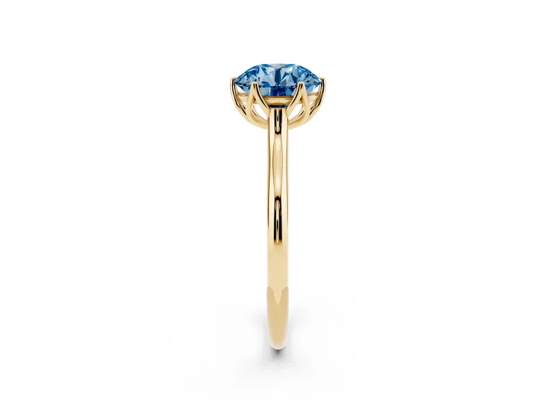 Fancy Blue Round Cut Diamond Solitaire Cathedral Ring Set in Yellow gold with Prong Setting