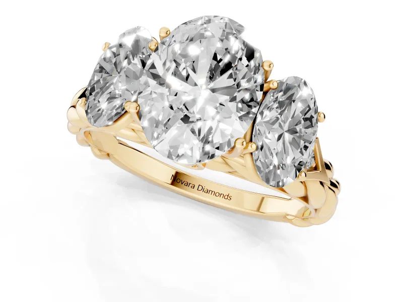 Oval Cut Diamond Three-Stone Ring Set in Yellow gold with Braided Band