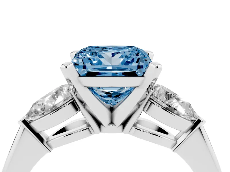 Fancy Blue Three-Stone Princess Cut Diamond Ring Set in Platinum with Pear Side Stones and Prong Setting