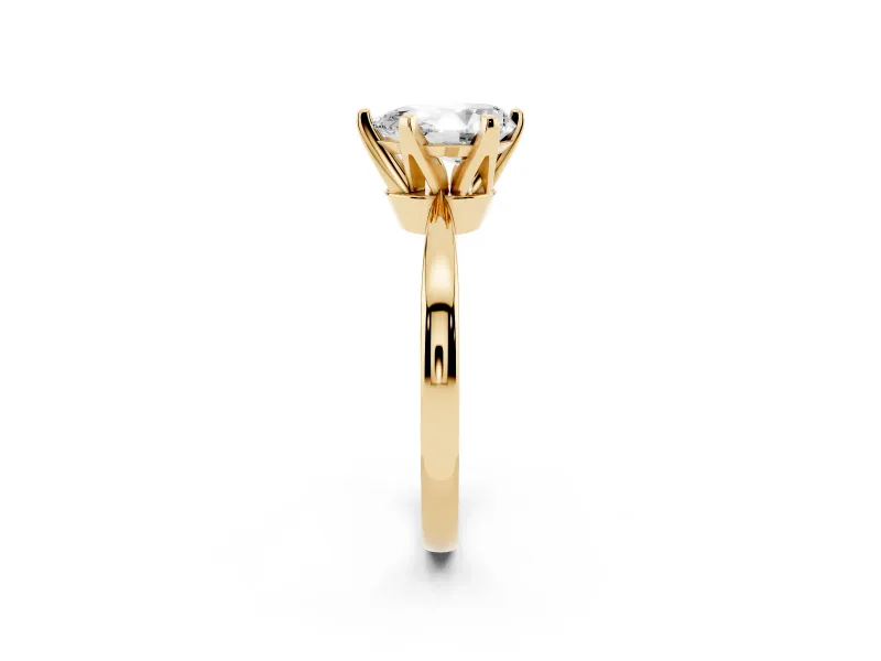 Pear Cut Diamond Solitaire Engagement Ring Set in Yellow gold with Slim Tapered Solitaire Band