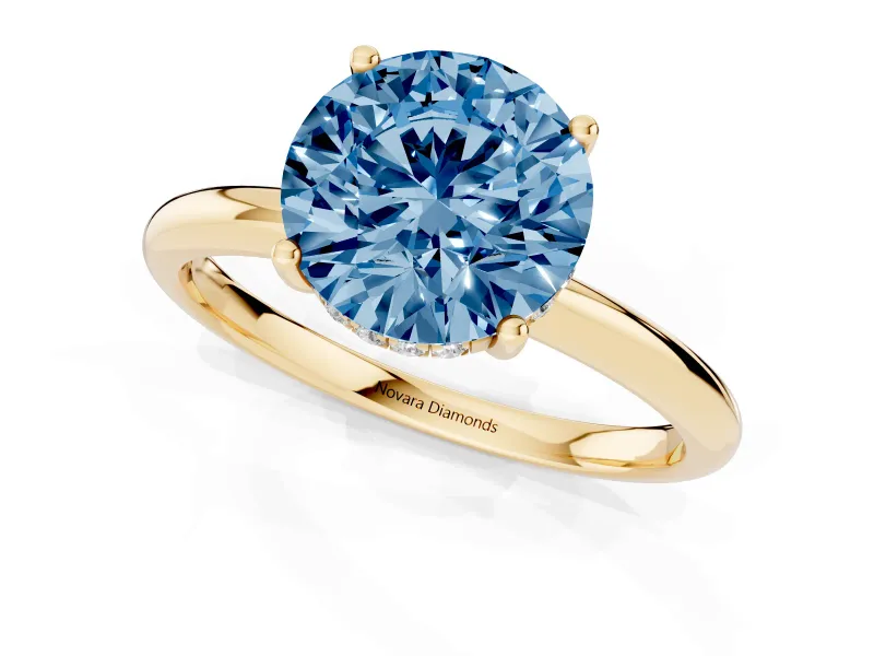 Fancy Blue Round Cut Diamond Solitaire Engagement Ring Set in Yellow gold with Prong Setting and Polished Band
