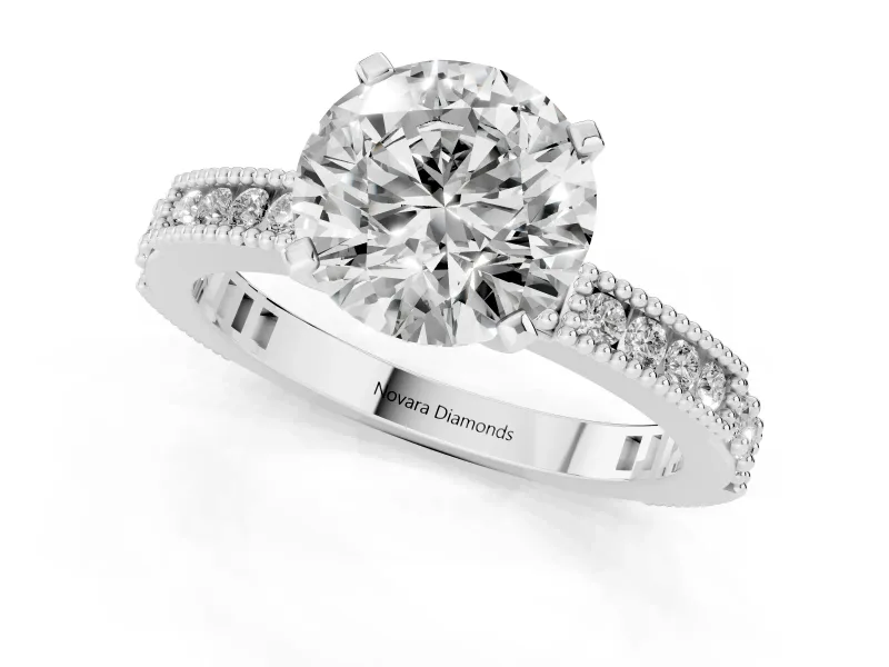 Round Cut Diamond Solitaire Ring Set in White gold with Slim Pavé Band and Prong Setting